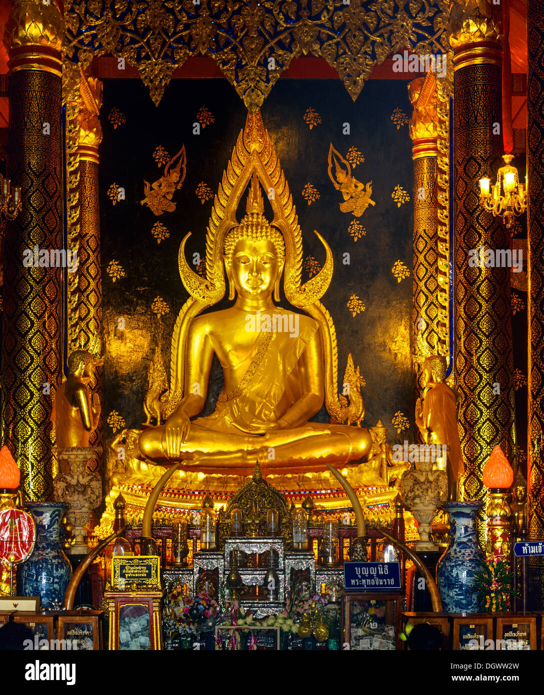 Golden Gautama Buddha Buddha in the posture of overcoming Mara, also called Mara submission, Buddha Phra Phuttha Chinnarat in Stock Photo