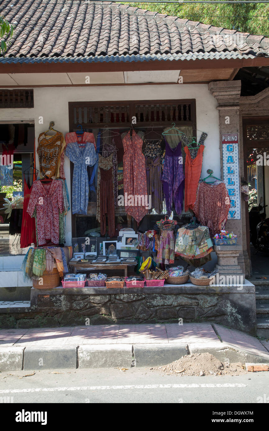 Clothes shop souvenirs gifts Ubud Bali Indonesia Asia color colorful items tourists attraction destination presents traditional Stock Photo