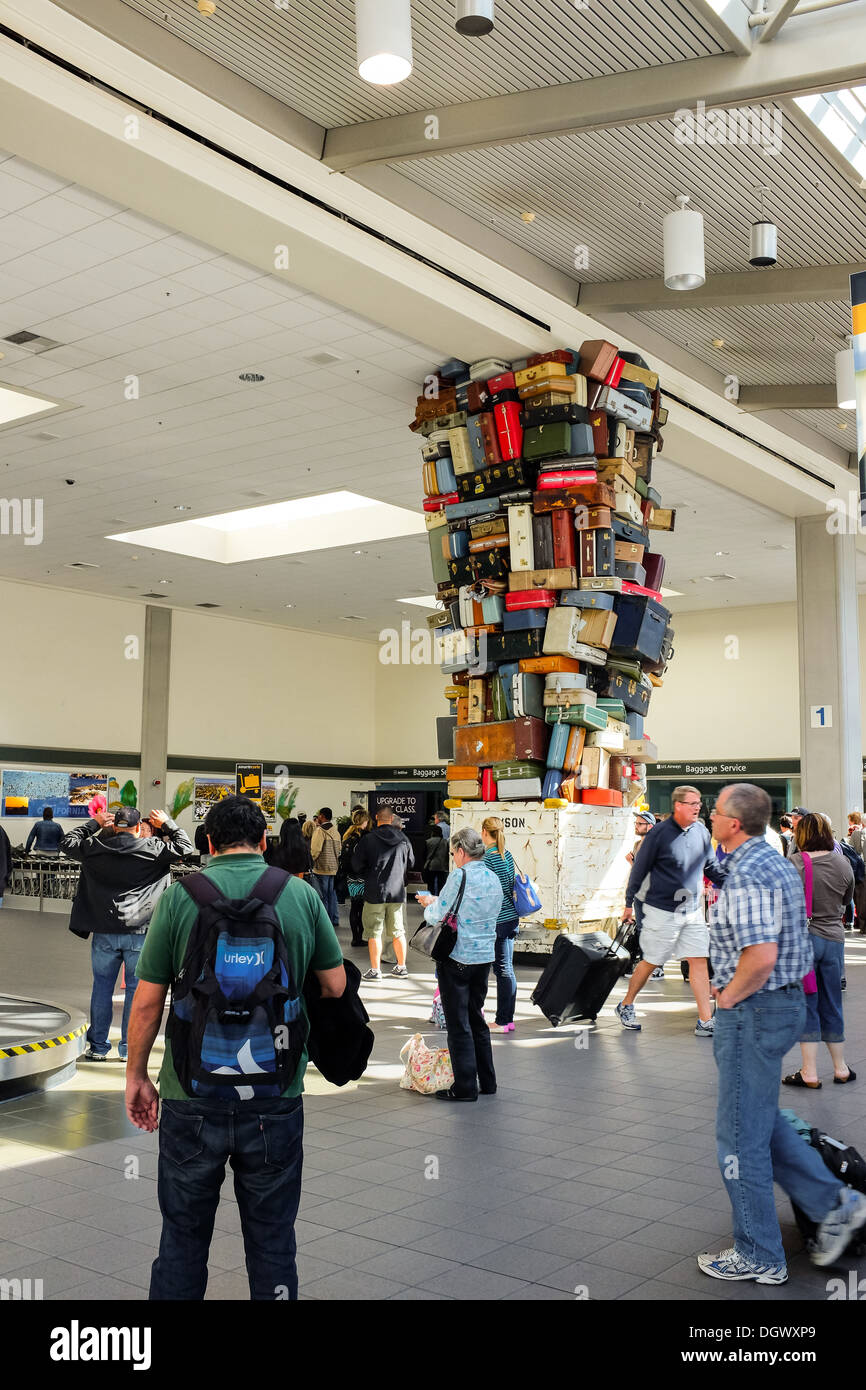 Travelers await the arrival of their baggage at the Sacramento Airport in California Stock Photo