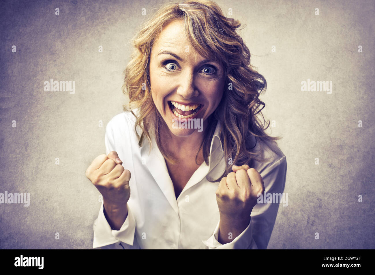 Blonde woman rejoicing Stock Photo