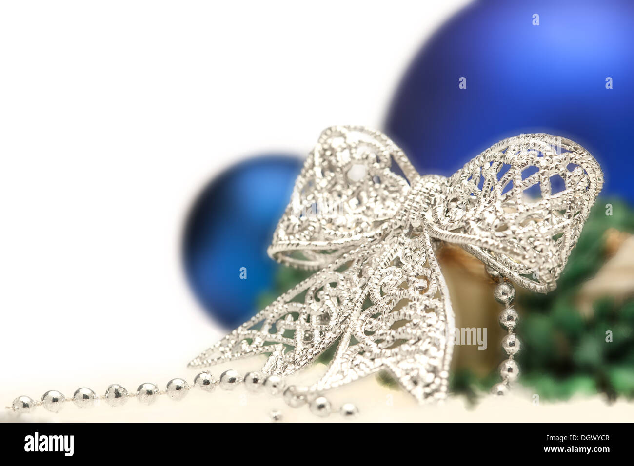 Christmas composition with silver bow and blue balls Stock Photo