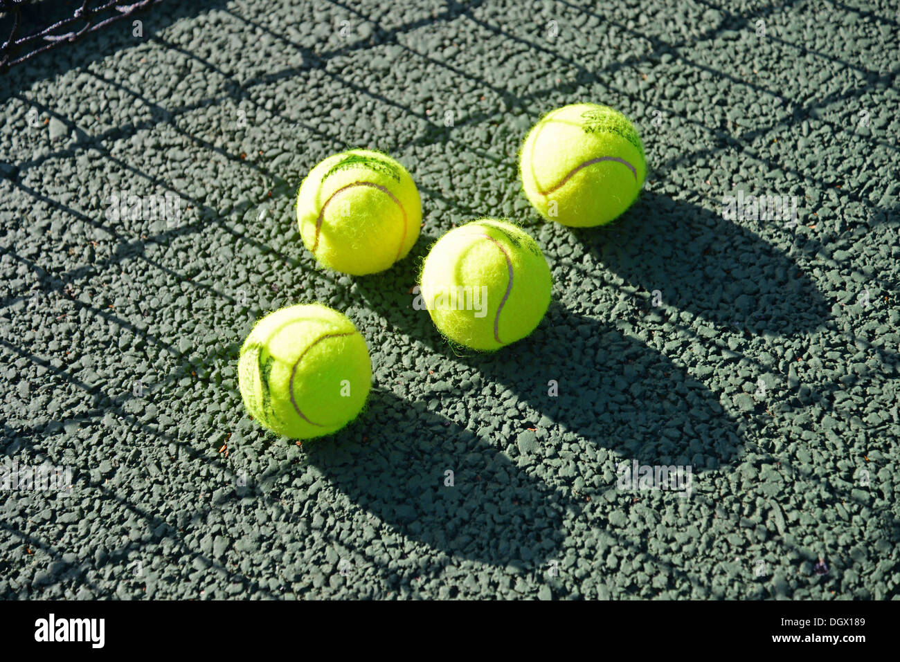Tennis balls on court, Royal Ascot Tennis Club, Ascot, Berkshire, England, United Kingdom Stock Photo