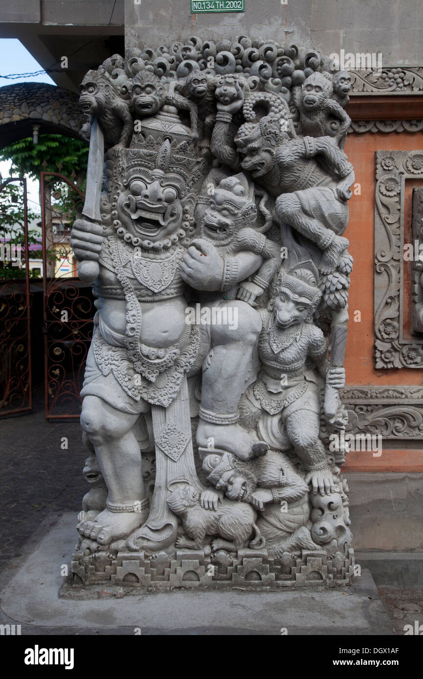 Religion decoration sculpture Ubud Bali Indonesia decorative stone carve carving hand made tradition ceremony ceremonial orange Stock Photo
