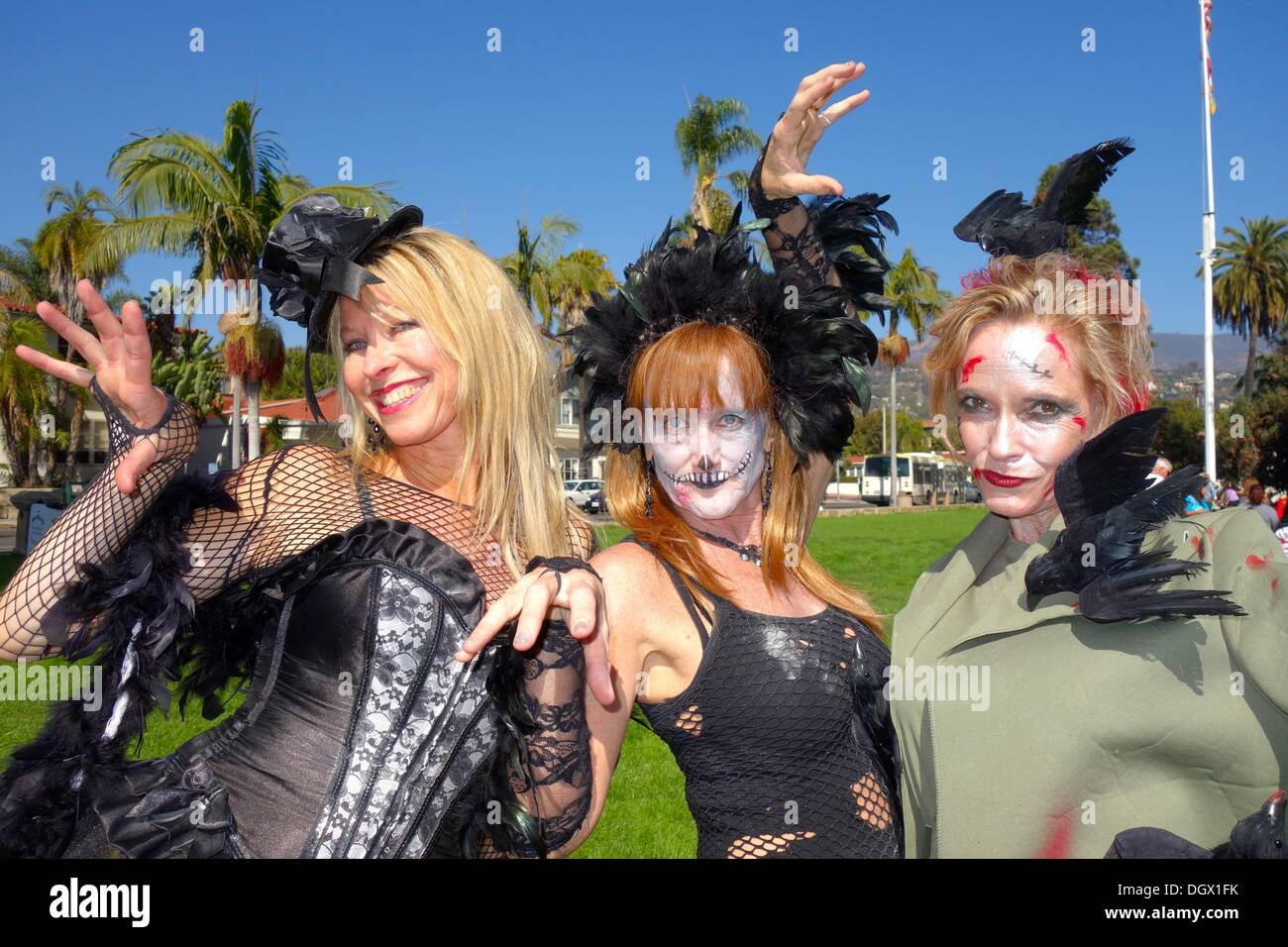 Santa Barbara, California USA – 26 October 2013 An estimated 10,000 zombie dancers at over 200 locations in over 25 countries perform Michael Jackson's 'Thriller' six minute dance at the same exact time at the 8th annual “Thrill The World” Halloween charity event. The Santa Barbara Courthouse Sunken Gardens $35 participation fee raises money for educational programs in Rwanda. Photo left to right: Teresa, Tracy and Beth all from Santa Barbara. October 26, 2013 Credit: Lisa Werner/ Alamy Live News Stock Photo