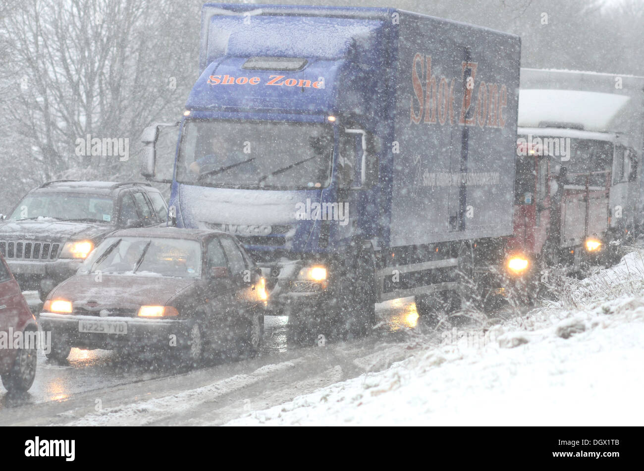 bumper to bumper road traffic during a snow storm Stock Photo Alamy