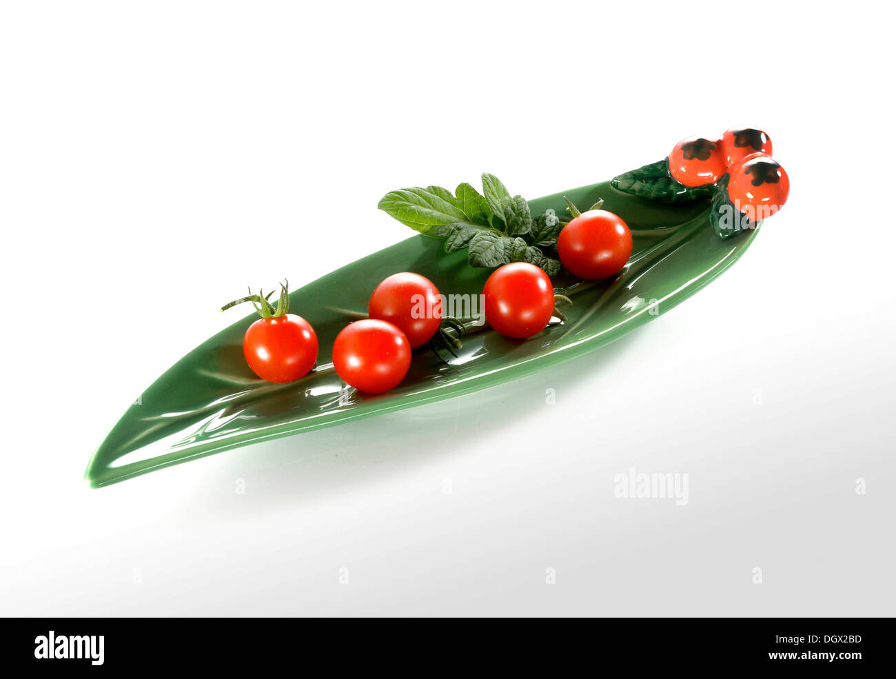 Cherry tomatoes in an elongated leaf-shaped bowl Stock Photo