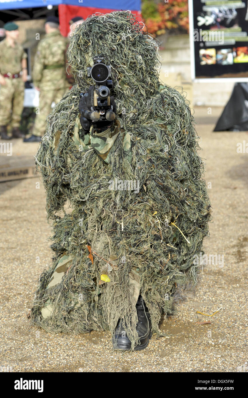 London, UK. 26th Oct, 2013. Rifleman Mitchell, a sniper from The Rifles light infantry regiment wearing a camouflage ghillie suit at the Reserves recruitment event on Horse Guards Parade. © Michael Preston/Alamy Live News Stock Photo