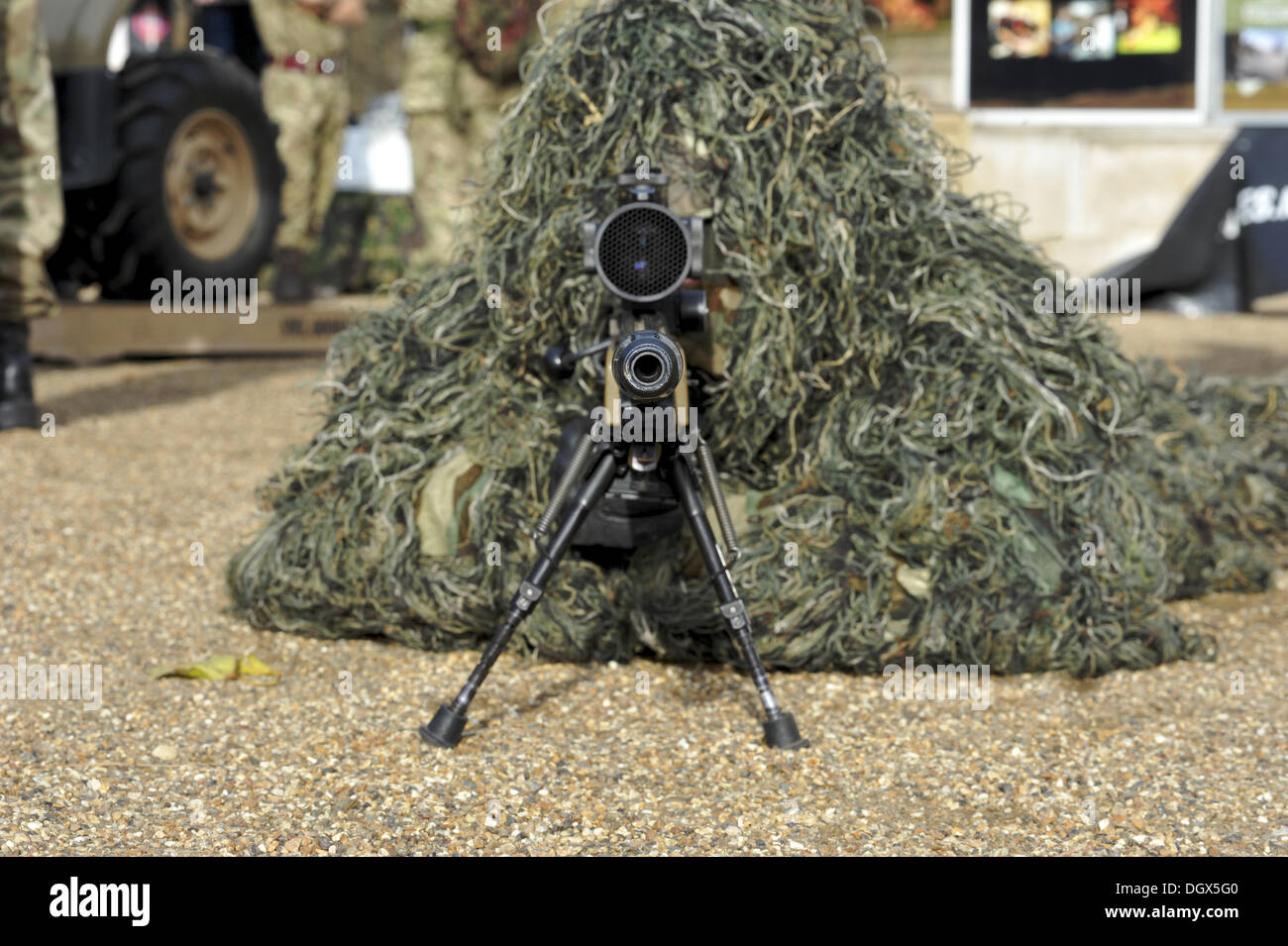 London, UK. 26th Oct, 2013. Rifleman Mitchell, a sniper from The Rifles light infantry regiment wearing a camouflage ghillie suit at the Reserves recruitment event on Horse Guards Parade. © Michael Preston/Alamy Live News Stock Photo