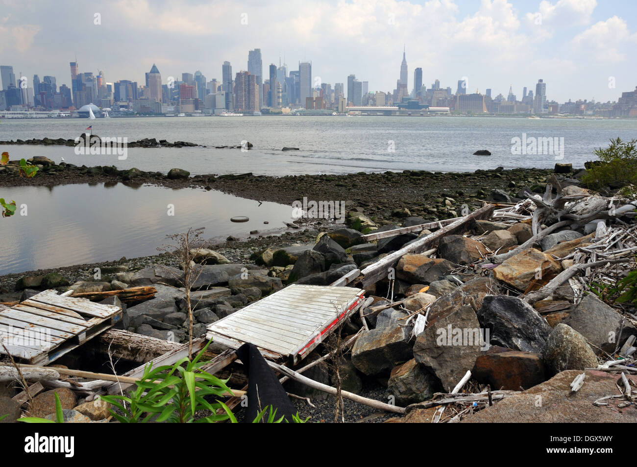View of Manhattan in New York City, USA - seen across the Hudson River from New Jersey, with a garbage dump in the foreground Stock Photo