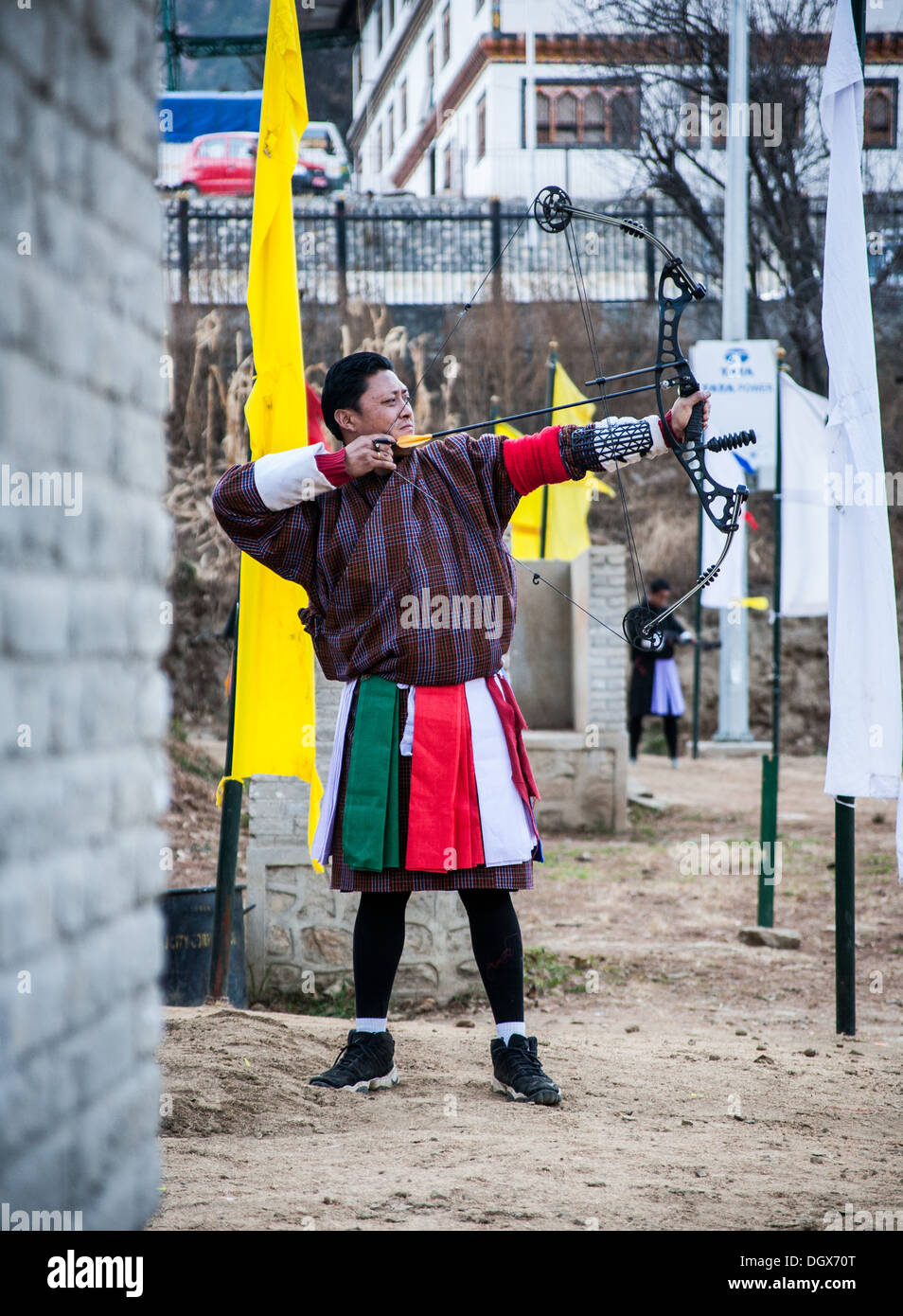 An archer takes aim towards his target 140 meters away. Thimphu, Bhutan Stock Photo