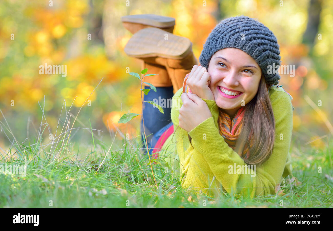 girl laying down in autumn time Stock Photo
