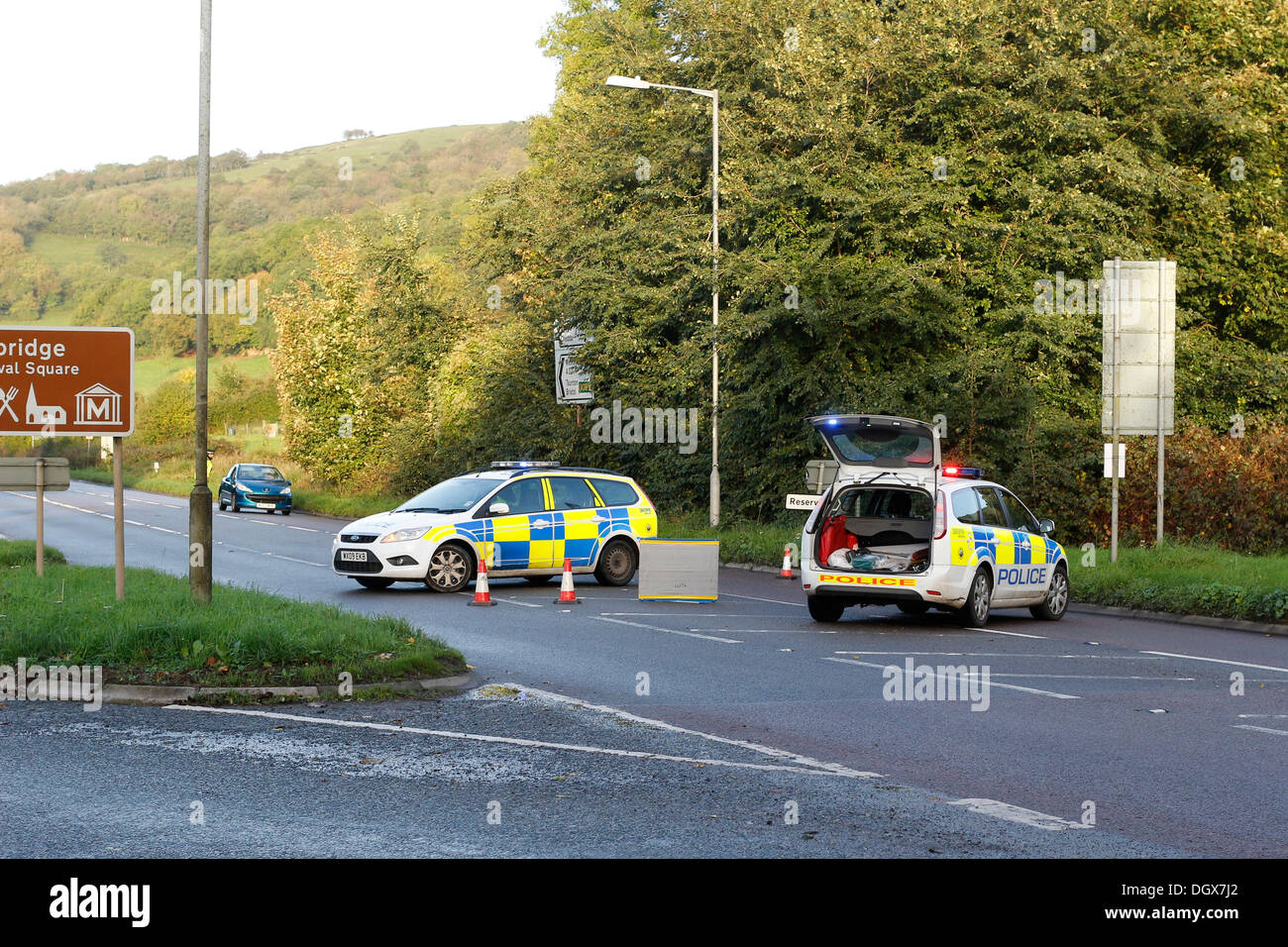 Cheddar, Somerset, UK. 27th Oct, 2013. Police cars blocking off the A371 Axbridge to Cheddar road. It is understood but not confirmed as a young guy walking back from a night out in Weston Super Mare was hit by a car during the early hours of the morning - 27 October 2013 Credit:  TW Photo Images/Alamy Live News Stock Photo