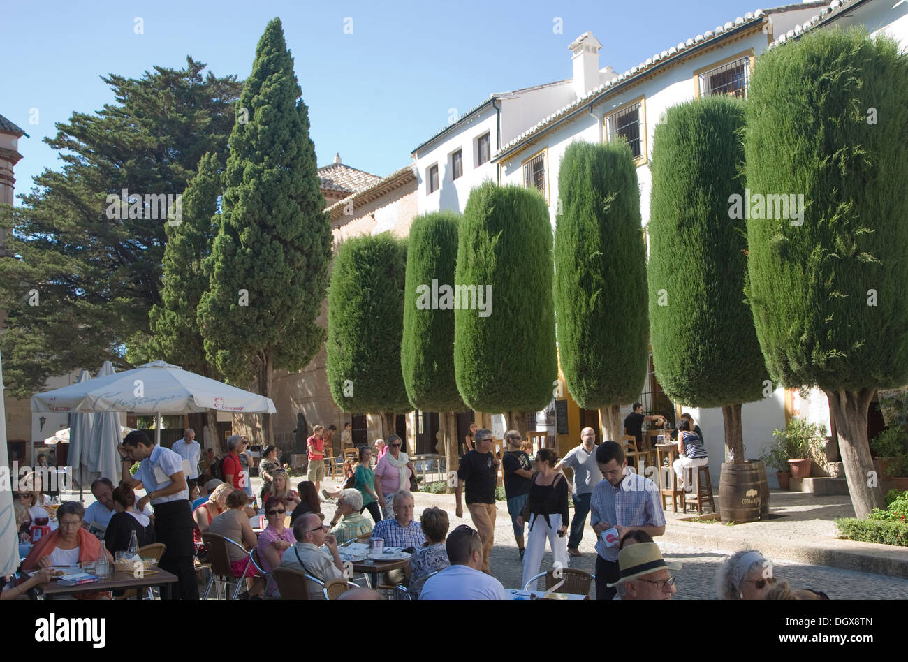 People at street cafe tables in old city Ronda Spain Stock Photo