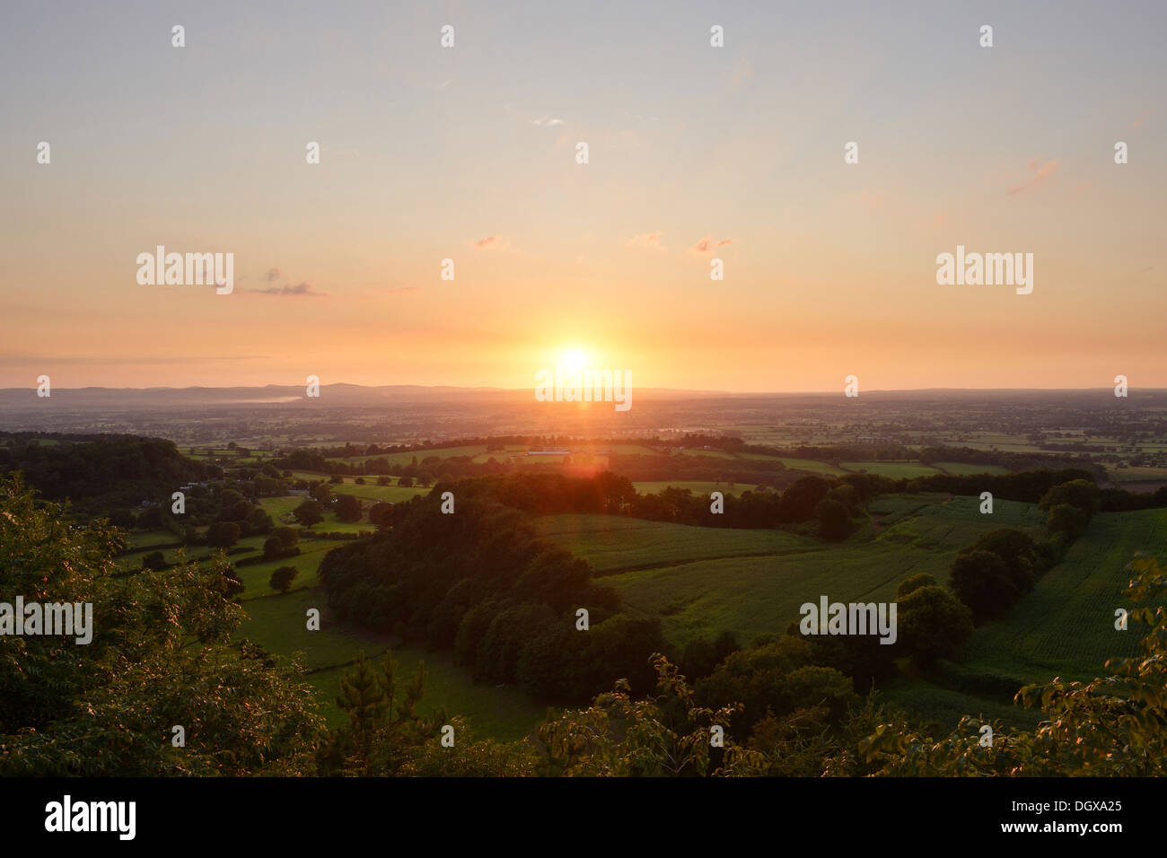 Sunset across rolling green fields and the Cheshire Plain UK Stock Photo