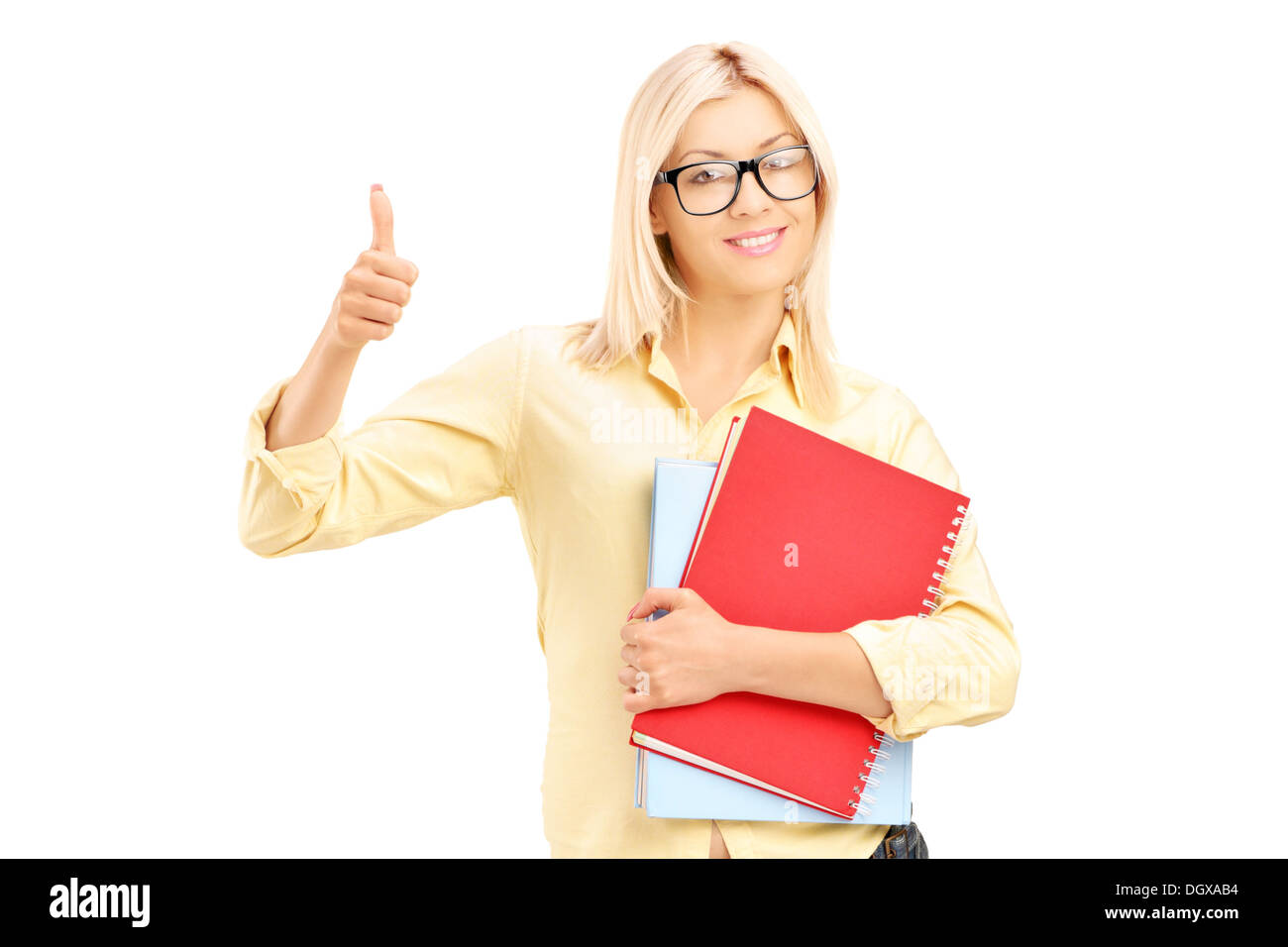 Female student giving a thumb up and holding notebooks Stock Photo - Alamy