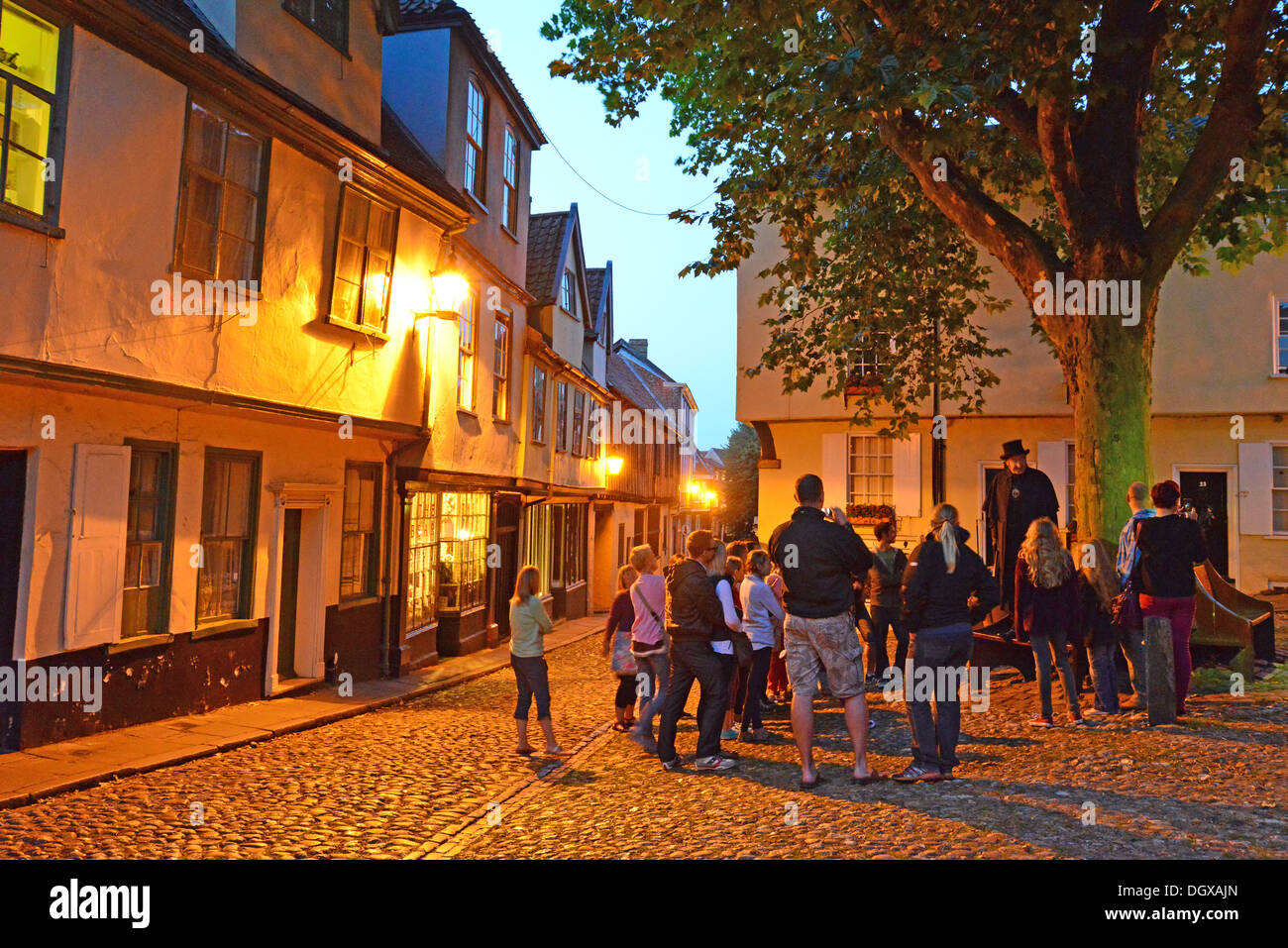Guided tour at dusk in Elm Hill, Norwich, Norfolk, England, United Kingdom Stock Photo