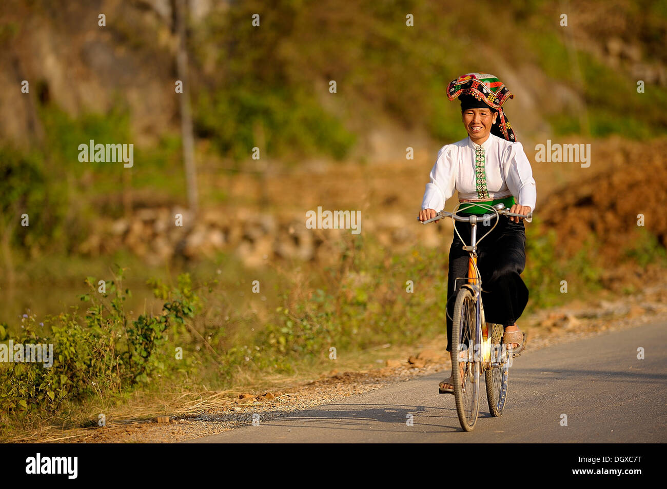 Vietnamese woman on bicycle, DinhBin, Hanoi, North Vietnam, Southeast Asia Stock Photo