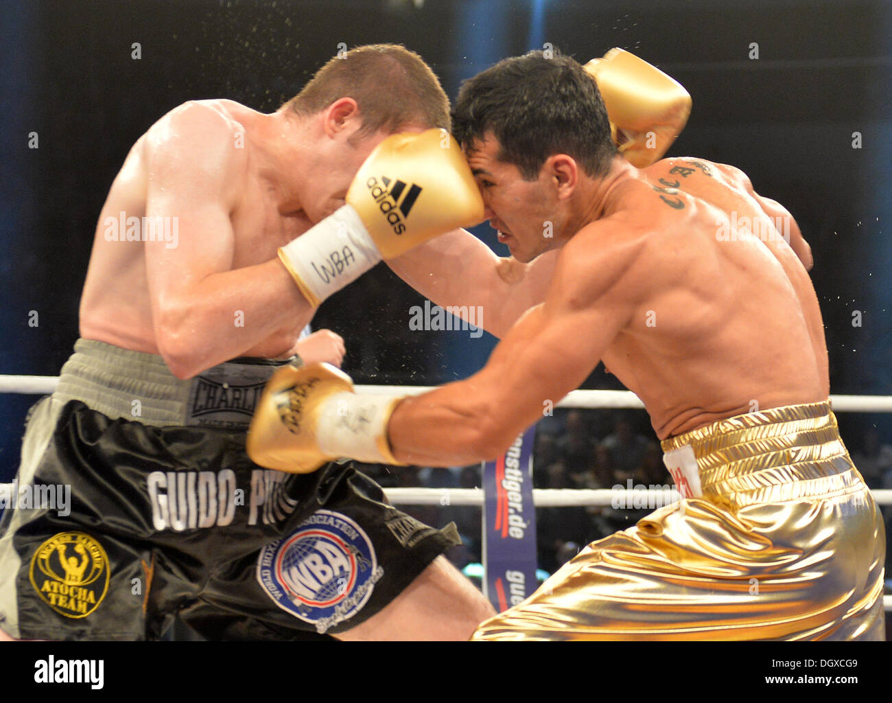 Oldenburg, Germany. 26th Oct, 2013. Jack Culcay (R) of Germany fights against Argentina's Guido Nicolas Petto in the WBA Intercontinental Middleweight Boxing Championship at the EWE Arena in Oldenburg, Germany, 26 October 2013. Photo: CARMEN JASPERSEN/dpa/Alamy Live News Stock Photo