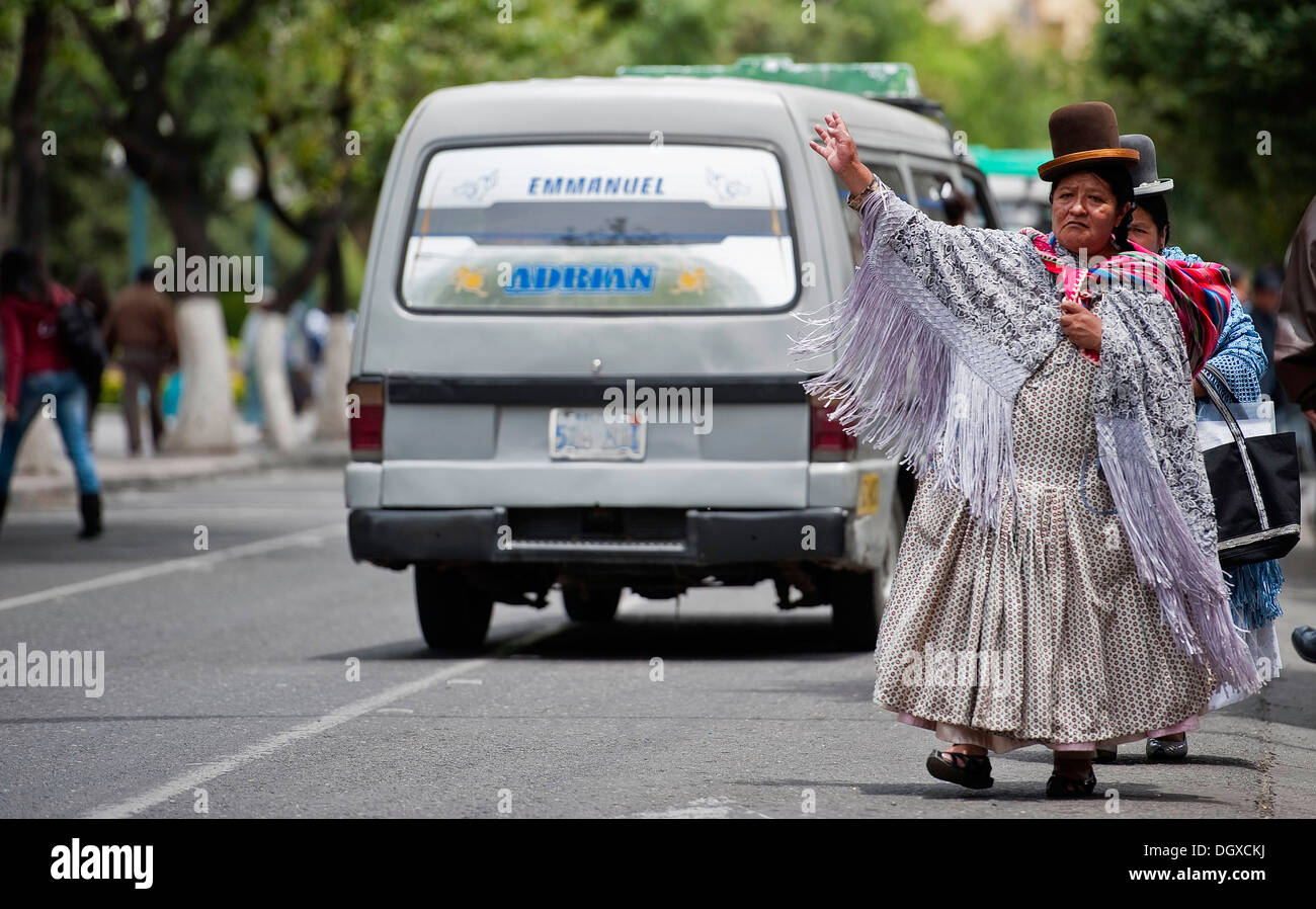 Indio women waiting for bus, La Paz, Bolivia, South America Stock Photo