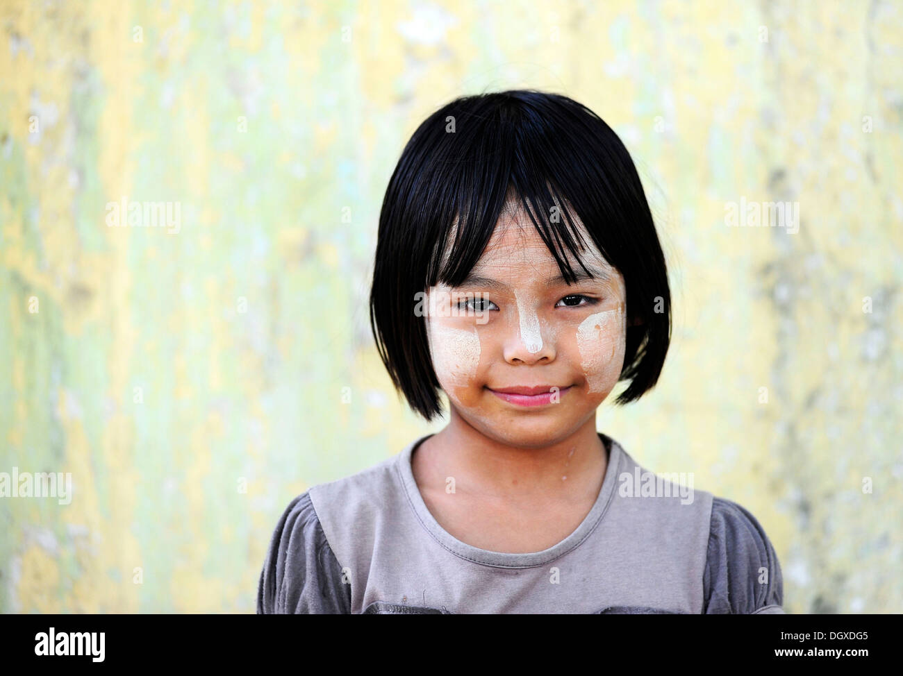 Girl with thanaka paste on her face, Mandalay, Myanmar, Burma, Southeast Asia, Asia Stock Photo