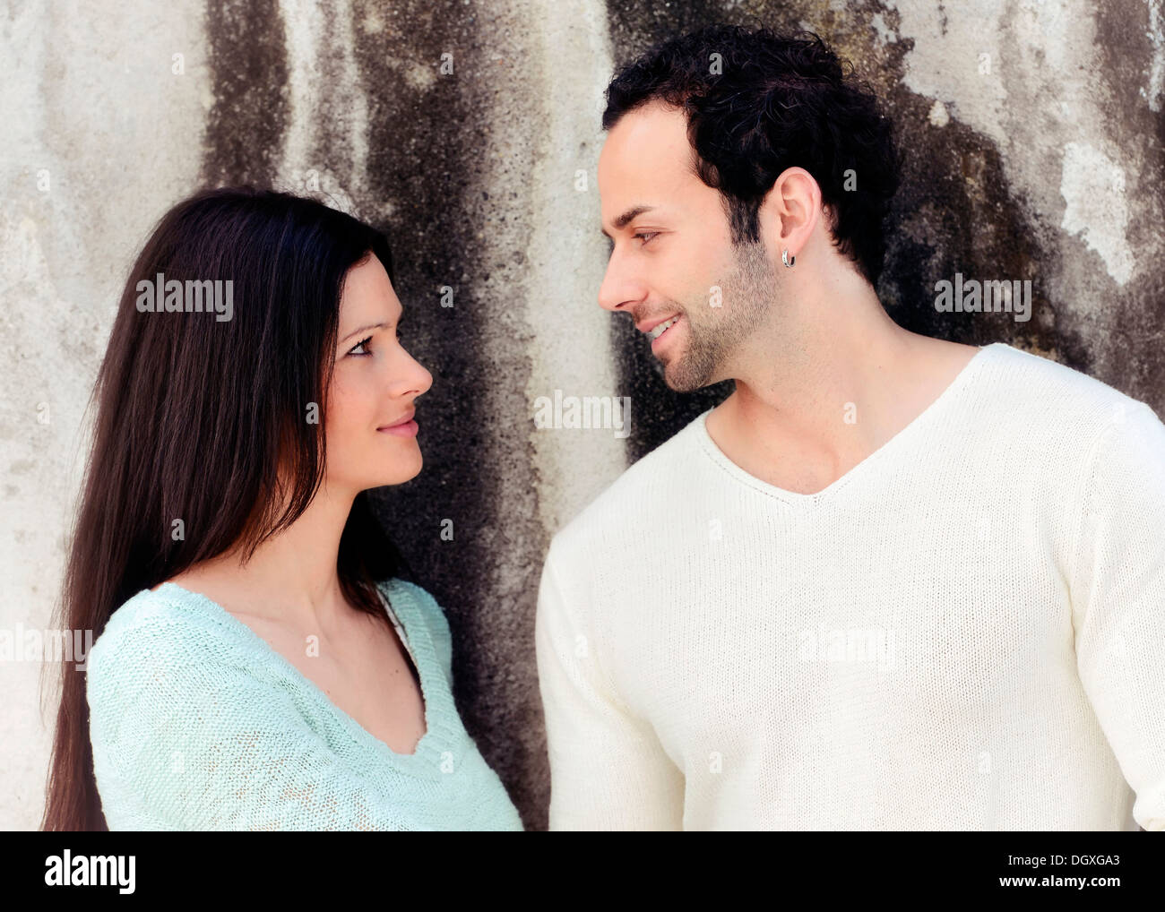 Young couple looking at each other, smiling, Austria Stock Photo