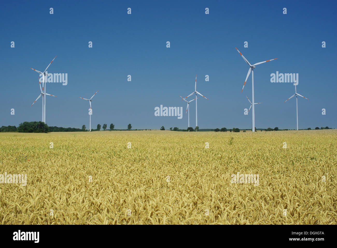 wind turbine on blue sky background Stock Photo - Alamy