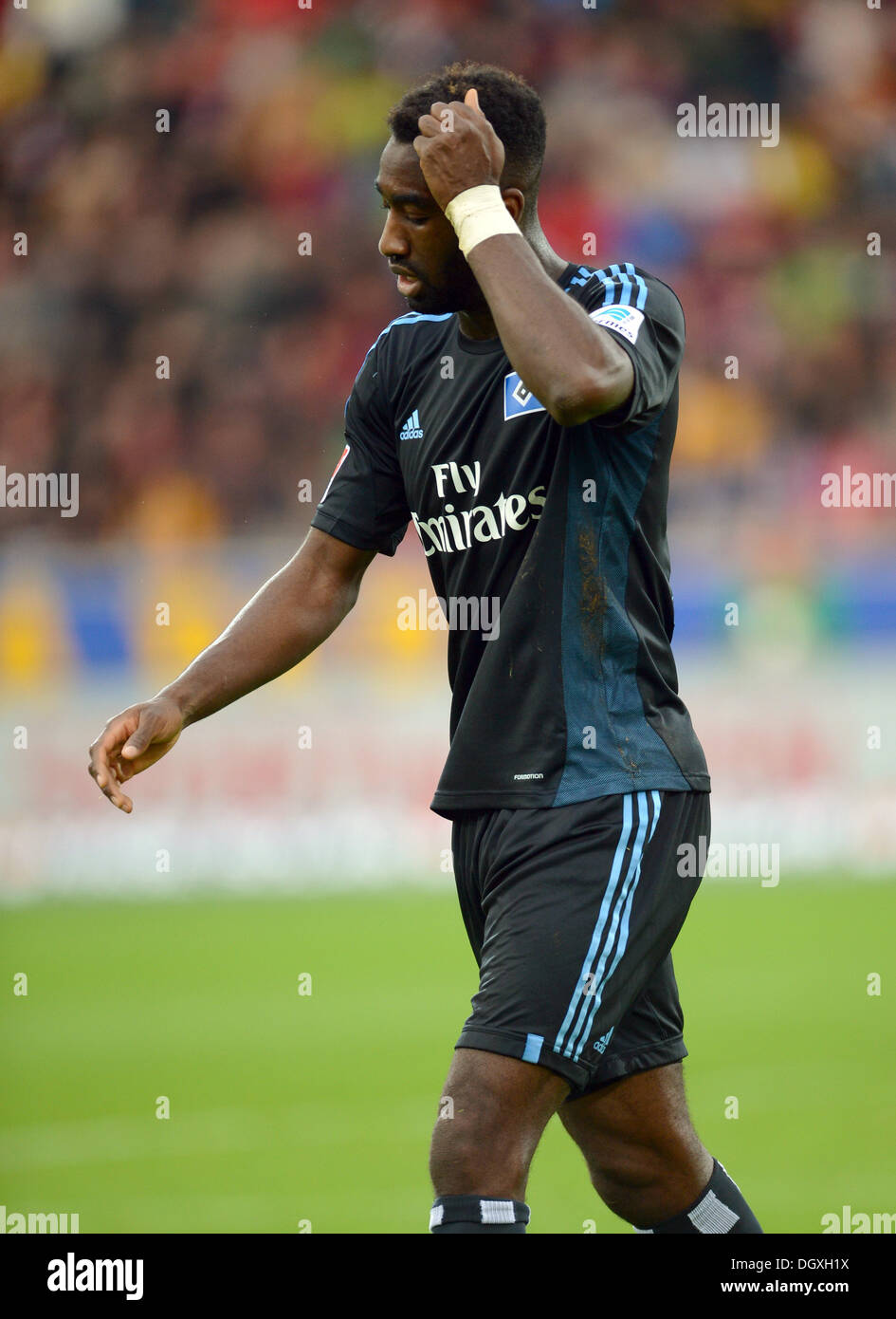 Freiburg, Germany. 27th Oct, 2013. Hamburg's Johan Djourou leaves the pitch during the German Bundesliga soccer match between SC Freiburg and Hamburger SV at the Mage Solar Stadium in Freiburg, Germany, 27 October 2013. Photo: PATRICK SEEGER (ATTENTION: Due to the accreditation guidelines, the DFL only permits the publication and utilisation of up to 15 pictures per match on the internet and in online media during the match.)/dpa/Alamy Live News Stock Photo
