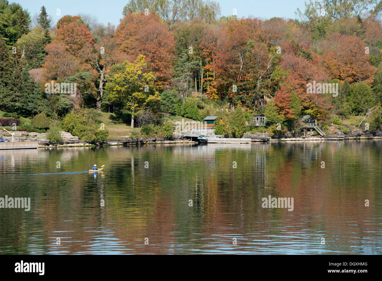 Canada, Ontario, Brockville. Kayaker on a calm fall morning along the Saint Lawrence Seaway. Stock Photo