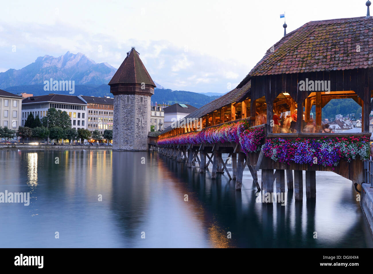 Chapel Bridge decorated with flowers and water tower, Lucerne, Switzerland, Europe Stock Photo