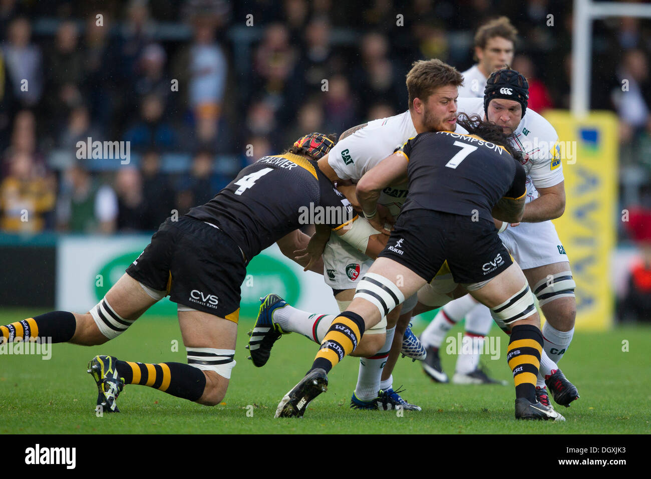 High Wycombe, GB - Ed Slater is tackled by Wasps' Tom Palmer and Guy Thompson. Action from the Aviva Premiership match between Northampton Saints and Saracens played at Adams Park, High Wycombe on Sunday 27 October 2013. Credit: Graham Wilson / Pipeline Images Stock Photo