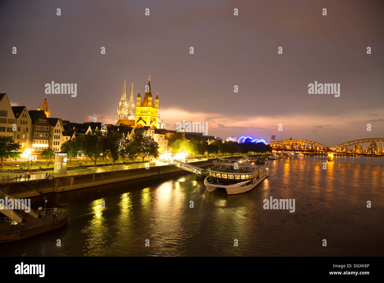 Nightly view on the cathedral of Cologne as well as the famous church Sankt Martin in the center of the city. Stock Photo