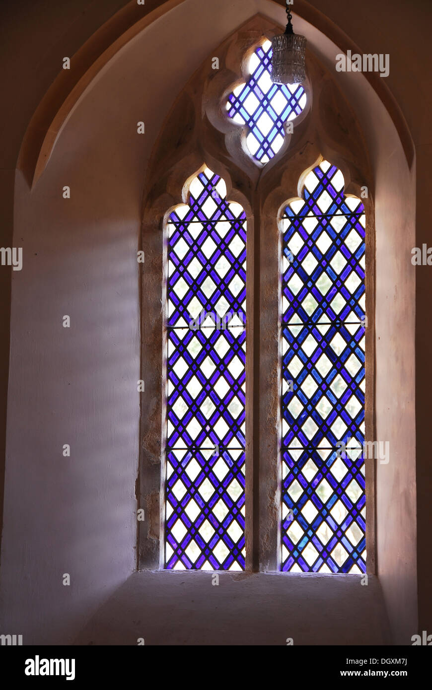 A geometric stained glass church window UK Stock Photo