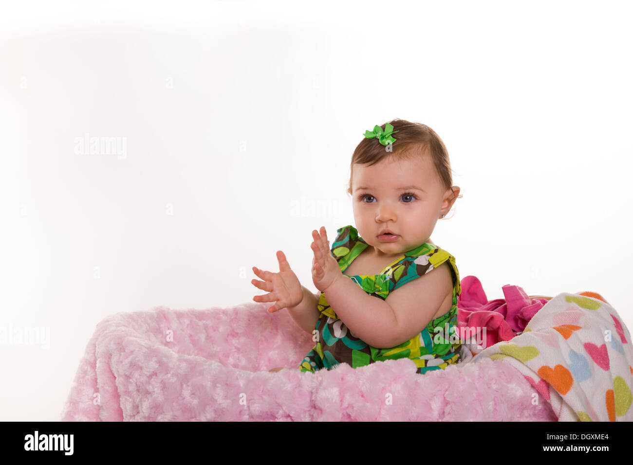 baby girl in laundry basket Stock Photo Alamy