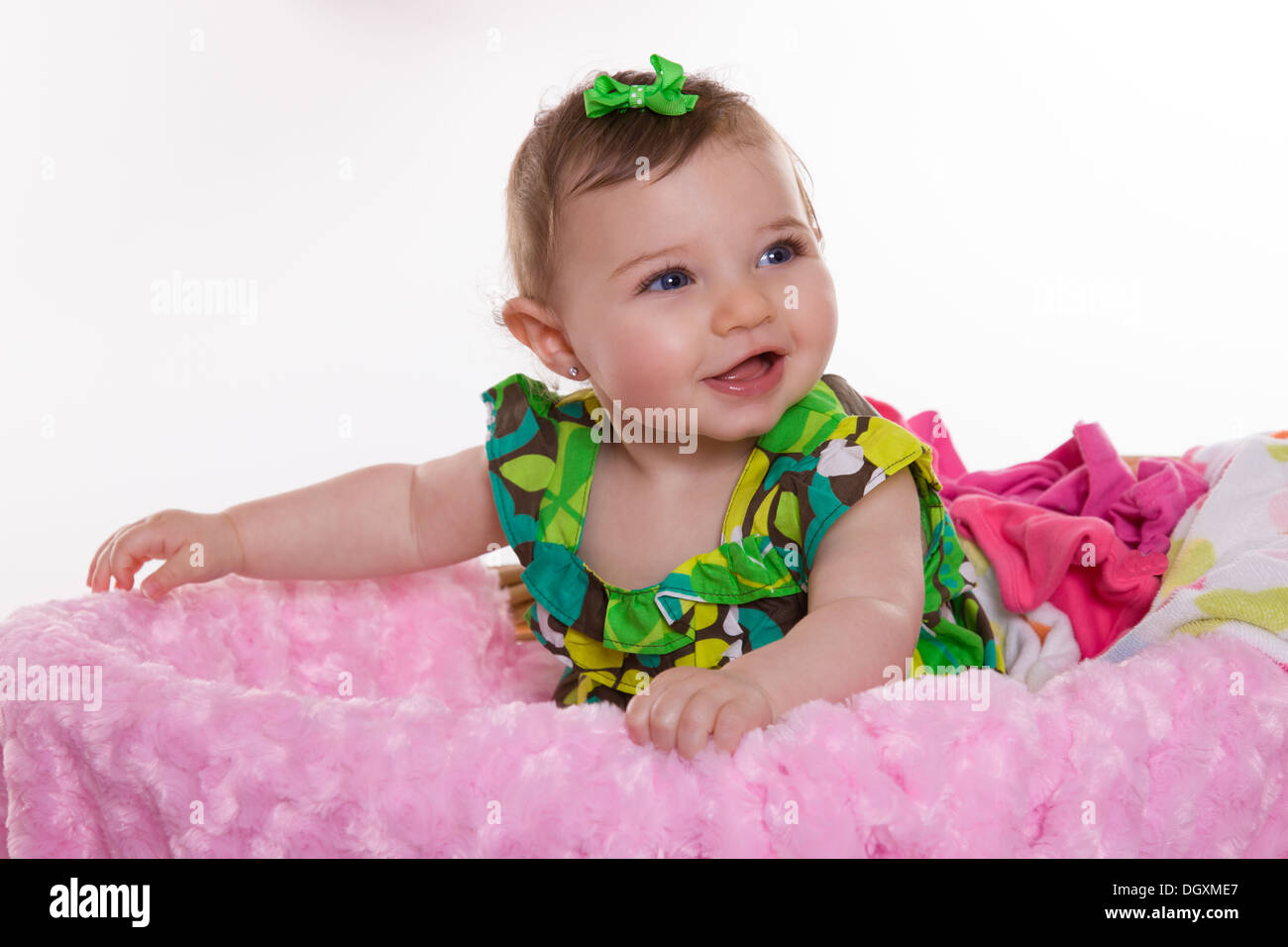 Baby girl in laundry basket Stock Photo Alamy