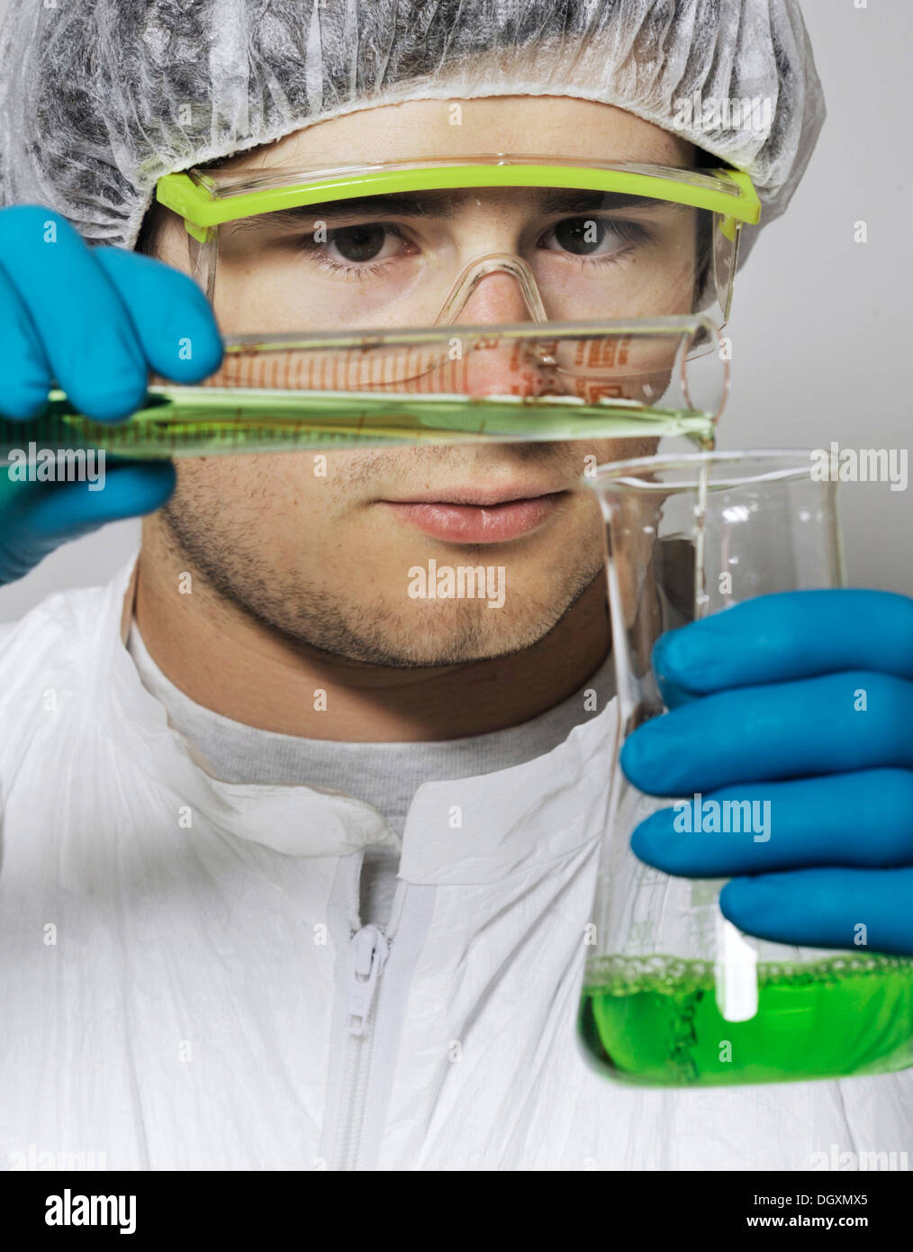 Intern or technician at a chemical experiment Stock Photo