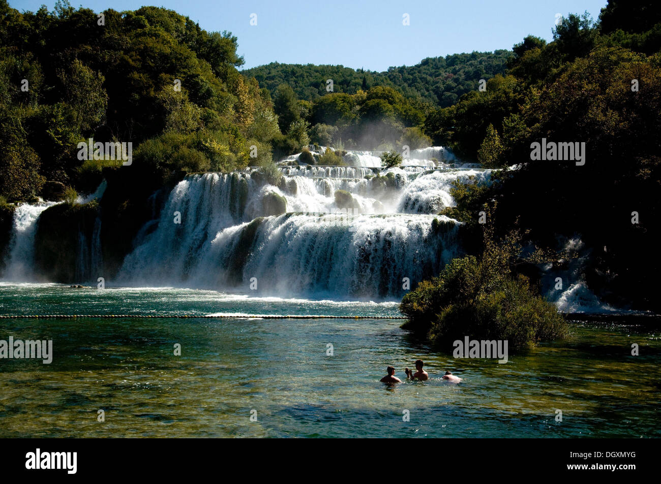 Swimmers enjoy the main waterfall, Skradinski Buk, in the Krka National Park in Croatia's Dalmatian coast Stock Photo