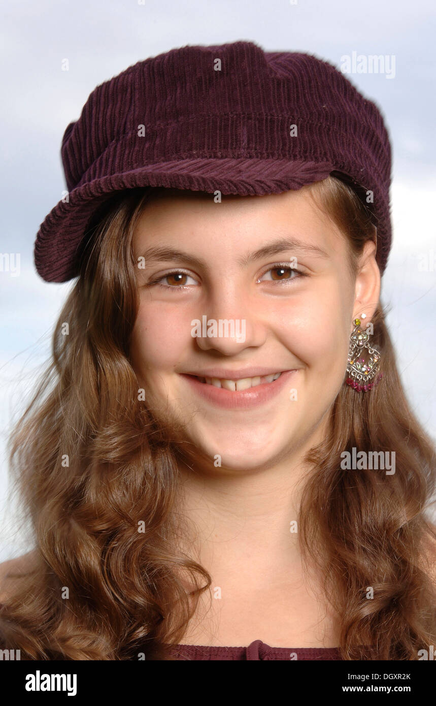 Teenage girl wearing a baseball cap, portrait Stock Photo Alamy