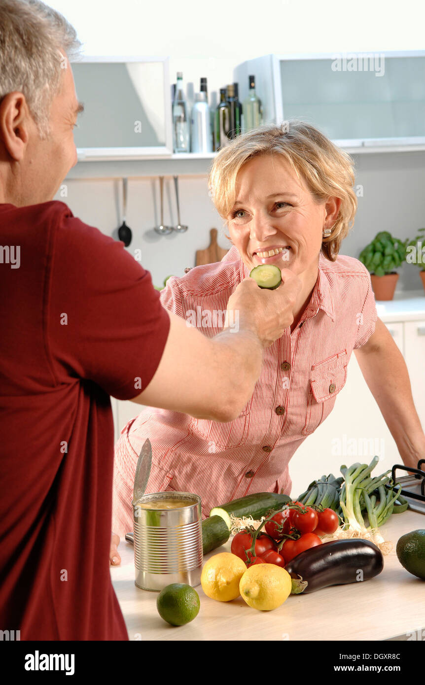 Couple, 35 - 45 years, in love, cooking in the kitchen Stock Photo