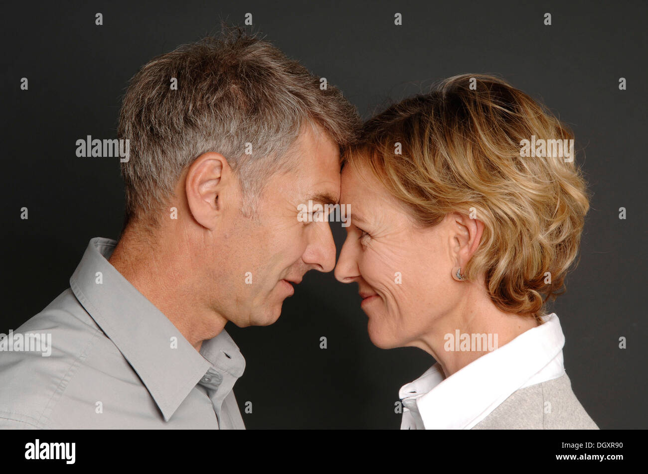 Couple, 35-45, standing face to face Stock Photo