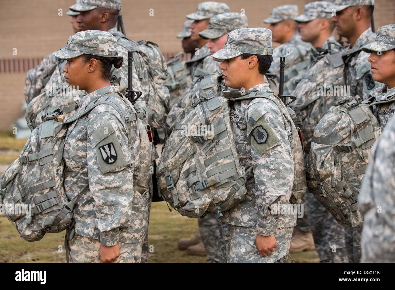 Male and female Drill Sergeant candidates at the US Army Drill Instructors School Fort Jackson during formation September 26, 2013 in Columbia, SC. While 14 percent of the Army is women soldiers there is a shortage of female Drill Sergeants. Stock Photo