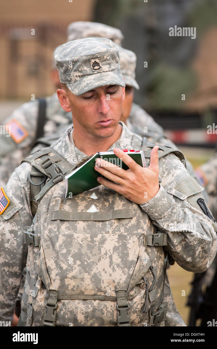 A male Drill Sergeant candidate reads from his manual at the US Army Drill Instructors School Fort Jackson during formation September 26, 2013 in Columbia, SC. While 14 percent of the Army is women soldiers there is a shortage of female Drill Sergeants. Stock Photo