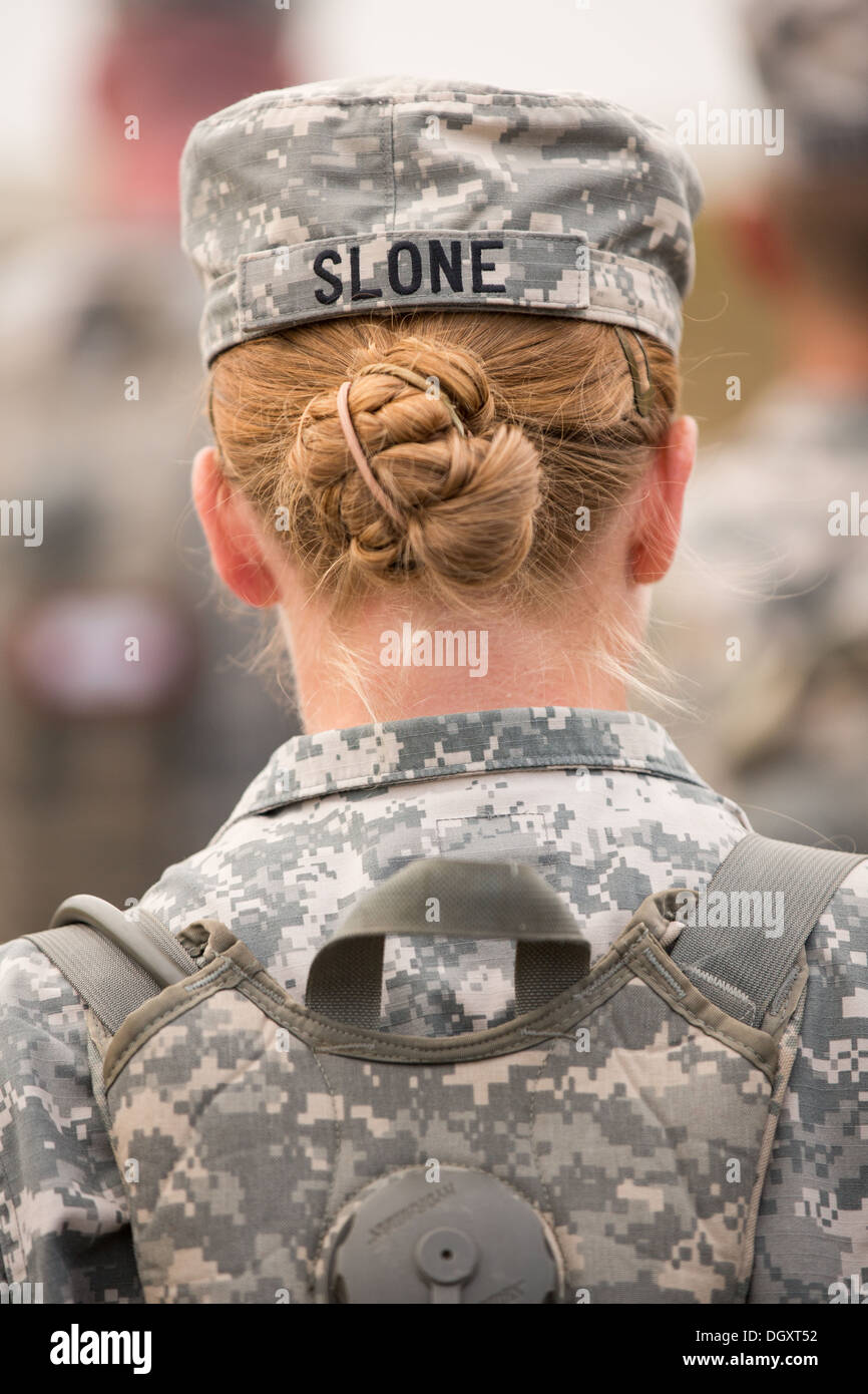 The hair bun of a female Drill Sergeant candidate show from under her hat at the US Army Drill Instructors School Fort Jackson during formation September 26, 2013 in Columbia, SC. While 14 percent of the Army is women soldiers there is a shortage of female Drill Sergeants. Stock Photo