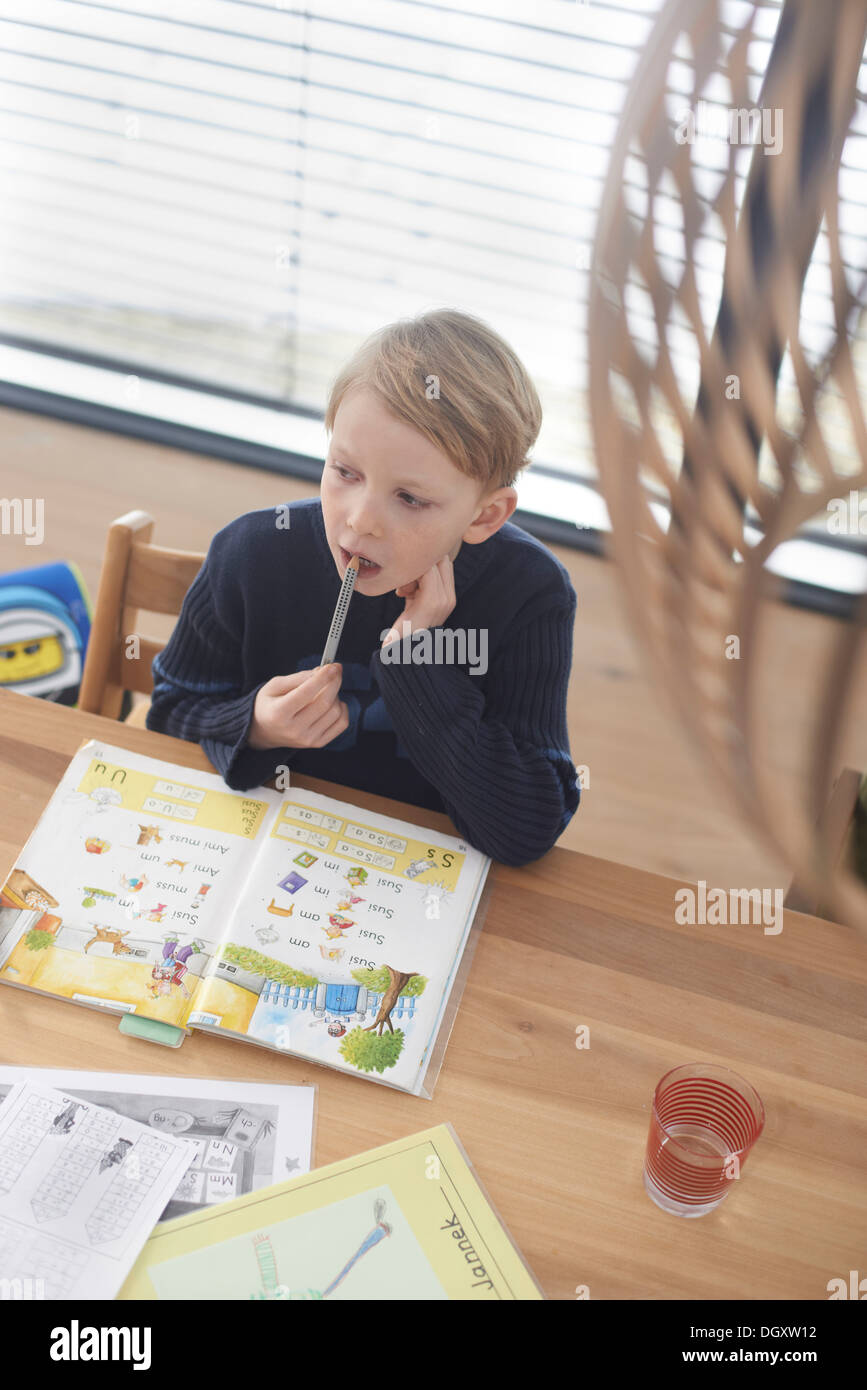 Schoolboy, 7 years, doing his homework, Germany Stock Photo