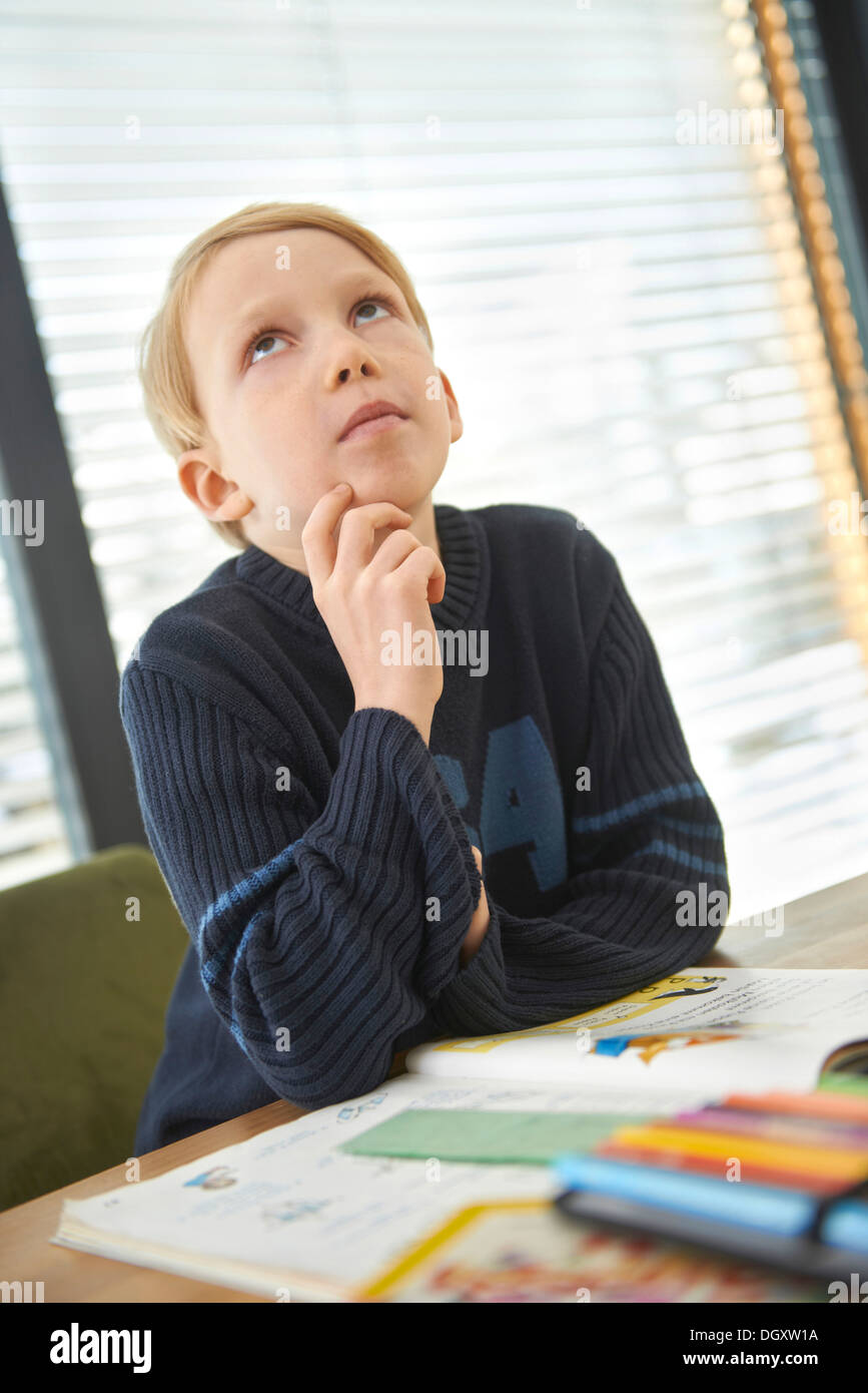 Schoolboy, 7 years, doing his homework, Germany Stock Photo