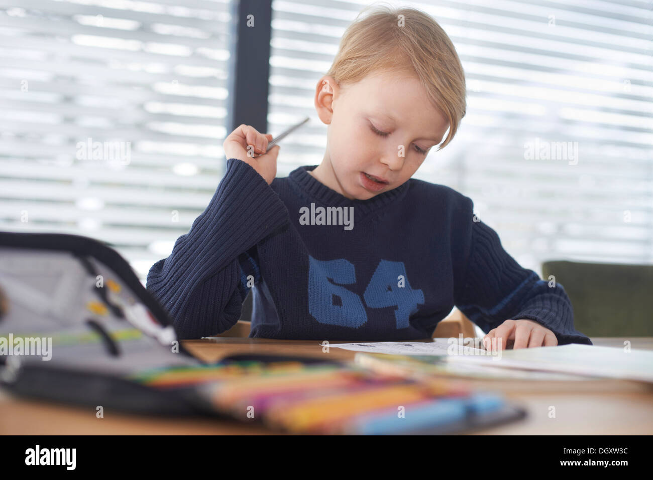 Schoolboy, 7 years, doing his homework, Germany Stock Photo