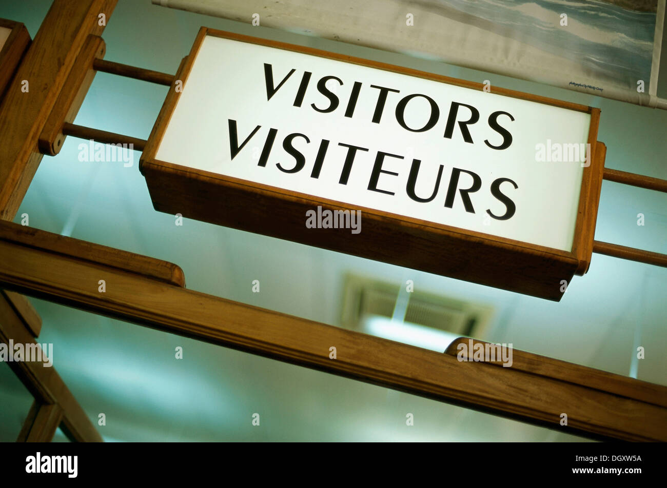 Sign, 'Visitors Visiteurs', customs desk for arriving passengers, Mahe, Seychelles Stock Photo