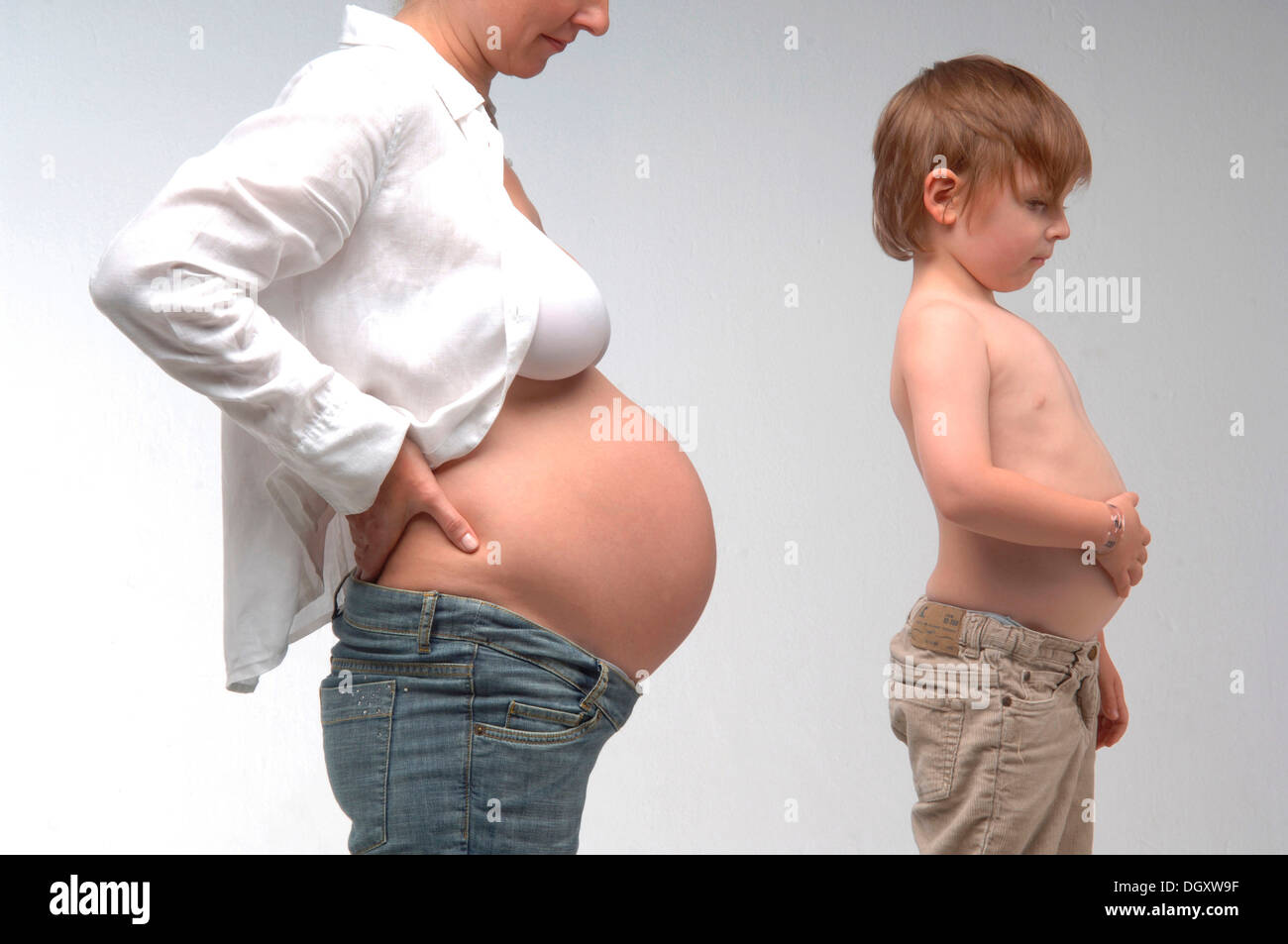 naked woman boy Pregnant woman with a naked belly standing beside a young boy with a naked  torso Stock Photo - Alamy