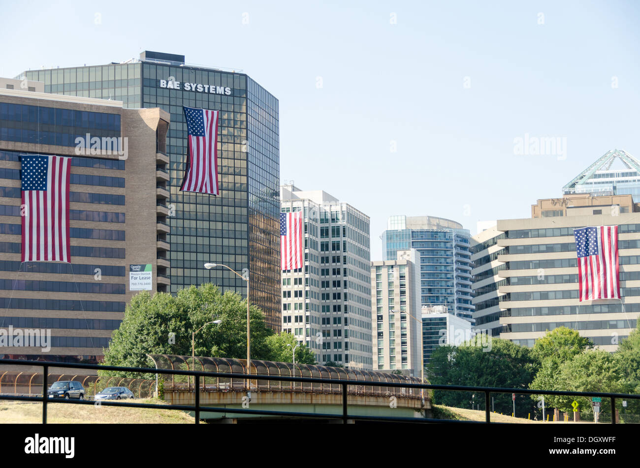 Defense contractors and other business based in Rosslyn, Virginia, drape large flags on the outside of their buildings for the anniversary of the 9/11 terrorist attacks. The Pentagon, which was the target of one of the attacks, is nearby. Stock Photo