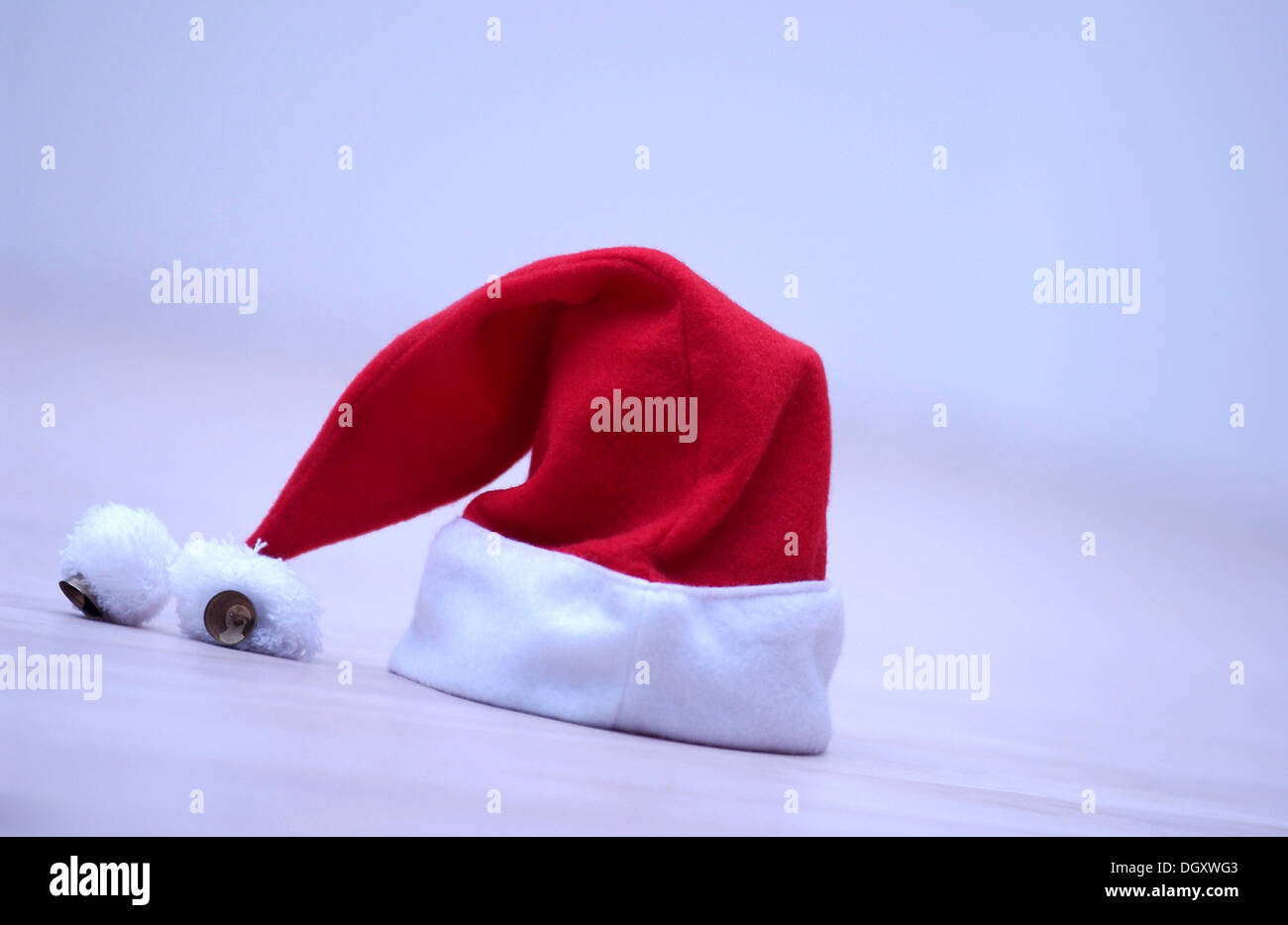 Red Santa Claus hat with bells Stock Photo