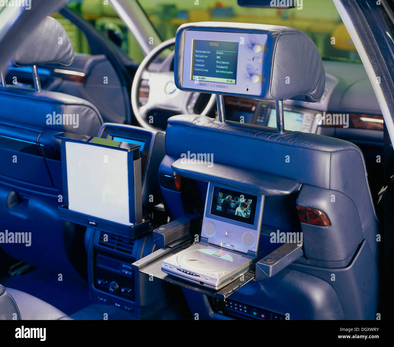 Headrest in a BMW with a built-in monitor with internet access, a console with a DVD player and a monitor Stock Photo